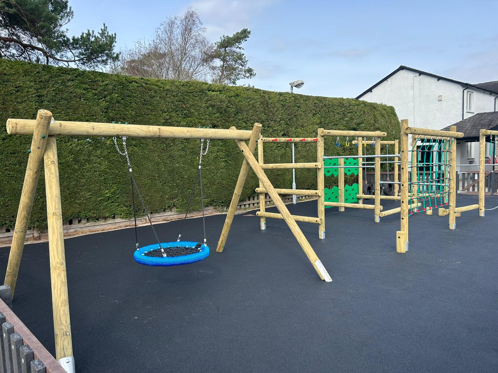 Basket Seat Swing - Timber & Wetpour Surfacing Basket Seat Swing - Timber & Wetpour Surfacing
